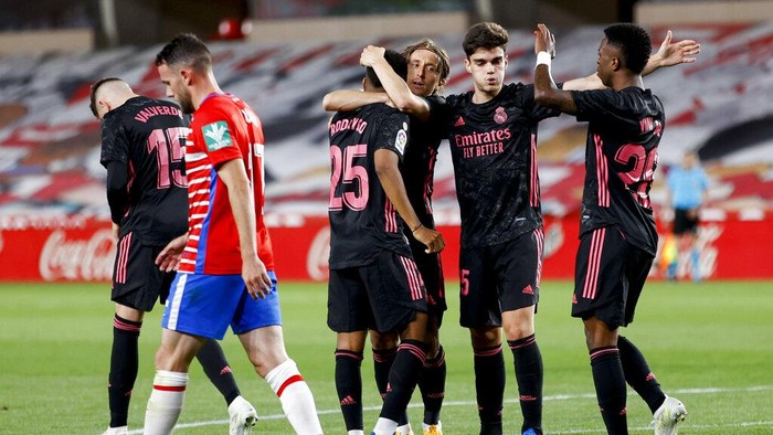 Real Madrids Rodrygo, center left, celebrates after scoring his sides second goal during the Spanish La Liga soccer match between Granada and Real Madrid at Los Carmenes stadium in Granada, Spain, Thursday, May 13, 2021. (AP Photo/Fermin Rodriguez)