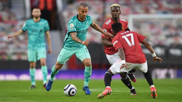 Manchester United vs Liverpool Soccer Football - Premier League - Manchester United v Liverpool - Old Trafford, Manchester, Britain - May 13, 2021 Liverpool's Thiago Alcantara in action with Manchester United's Paul Pogba and Fred Pool via REUTERS/Michael Regan EDITORIAL USE ONLY. No use with unauthorized audio, video, data, fixture lists, club/league logos or 'live' services. Online in-match use limited to 75 images, no video emulation. No use in betting, games or single club /league/player publications. Please contact your account representative for further details.