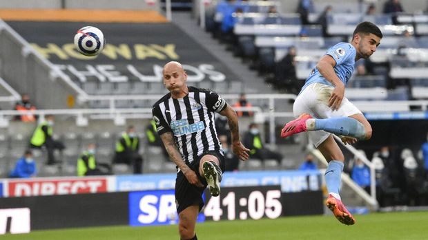 Manchester City's Ferran Torres celebrates after scoring his side's second goal during the English Premier League soccer match between Newcastle United and Manchester City at St James' Park stadium, in Newcastle, England, Friday, May 14, 2021. (Stu Forster/Pool via AP)