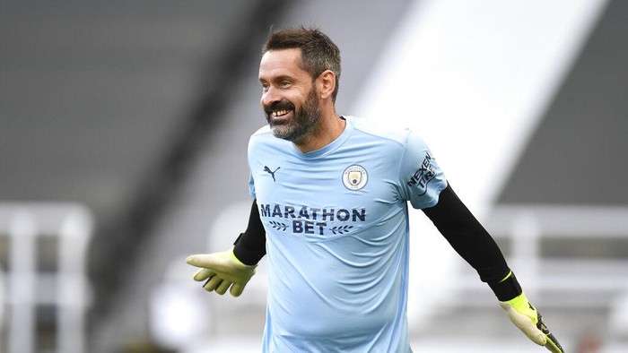 Manchester Citys goalkeeper Scott Carson warms up prior to the English Premier League soccer match between Newcastle United and Manchester City at St James Park stadium, in Newcastle, England, Friday, May 14, 2021. (Peter Powell/Pool via AP)