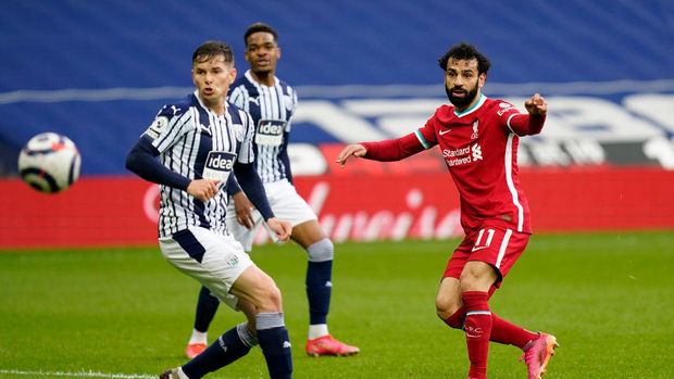 WEST BROMWICH, ENGLAND - MAY 16: Mohamed Salah of Liverpool scores their team's first goal during the Premier League match between West Bromwich Albion and Liverpool at The Hawthorns on May 16, 2021 in West Bromwich, England. Sporting stadiums around the UK remain under strict restrictions due to the Coronavirus Pandemic as Government social distancing laws prohibit fans inside venues resulting in games being played behind closed doors. (Photo by Tim Keeton - Pool/Getty Images)