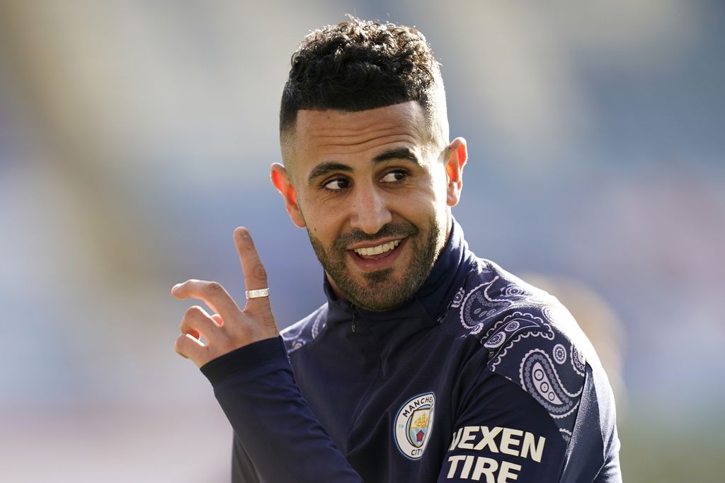LEICESTER, ENGLAND - APRIL 03: Riyad Mahrez of Manchester City looks on as he warms up prior to the Premier League match between Leicester City and Manchester City at The King Power Stadium on April 03, 2021 in Leicester, England. Sporting stadiums around the UK remain under strict restrictions due to the Coronavirus Pandemic as Government social distancing laws prohibit fans inside venues resulting in games being played behind closed doors. (Photo by Tim Keeton - Pool/Getty Images)