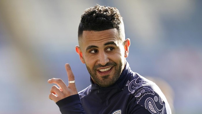 LEICESTER, ENGLAND - APRIL 03: Riyad Mahrez of Manchester City looks on as he warms up prior to the Premier League match between Leicester City and Manchester City at The King Power Stadium on April 03, 2021 in Leicester, England. Sporting stadiums around the UK remain under strict restrictions due to the Coronavirus Pandemic as Government social distancing laws prohibit fans inside venues resulting in games being played behind closed doors. (Photo by Tim Keeton - Pool/Getty Images)