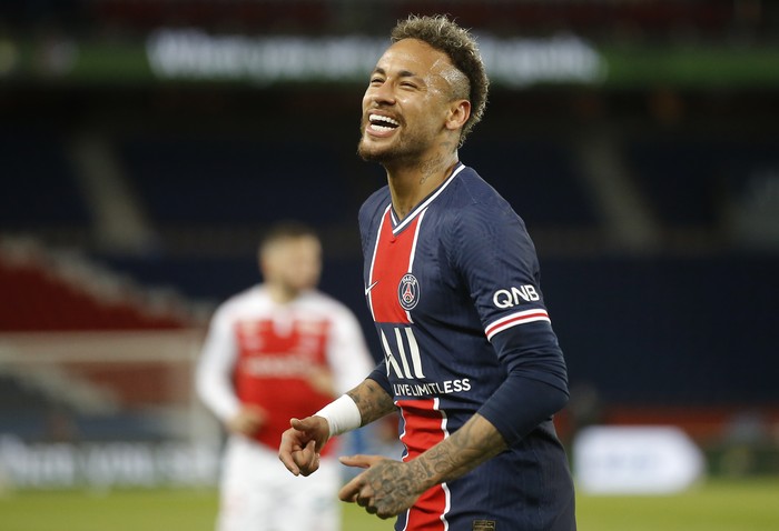 PSG's Neymar smiles during the French League One soccer match between Paris Saint-Germain and Reims at the Parc des Princes stadium in Paris, France, Sunday, May 16, 2021. (AP Photo/Michel Euler)