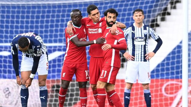 West Bromwich Albion vs Liverpool Soccer Football - Premier League - West Bromwich Albion v Liverpool - The Hawthorns, West Bromwich, Britain - May 16, 2021 Liverpool's Mohamed Salah celebrates scoring their first goal with Sadio Mane and Roberto Firmino Pool via REUTERS/Laurence Griffiths EDITORIAL USE ONLY. No use with unauthorized audio, video, data, fixture lists, club/league logos or 'live' services. Online in-match use limited to 75 images, no video emulation. No use in betting, games or single club /league/player publications. Please contact your account representative for further details.