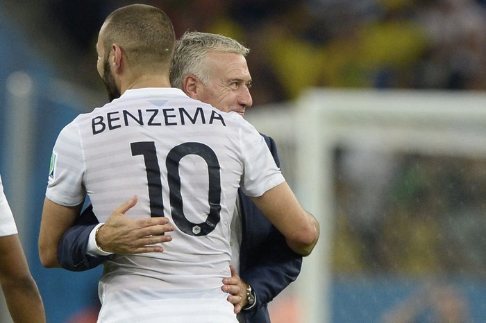 (FILES) In this file photo taken on June 26, 2014 Frances coach Didier Deschamps (back) and Frances forward Karim Benzema hug  after France drew 0-0 at the end of the Group E football match between Ecuador and France at the Maracana Stadium in Rio de Janeiro during the 2014 FIFA World Cup. - Frances head coach Deschamps calls Benzema back into the national team for the upcoming Euro, AFP reports on May 18, 2021. (Photo by Franck FIFE / AFP)
