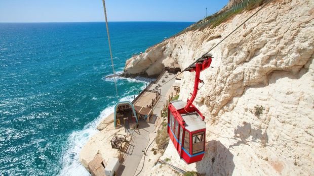 Rosh HaNikra Beautiful view on the red cable car with the cliffs of Rosh Hanikra