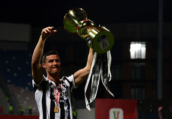 Cristiano Ronaldo REGGIO NELL'EMILIA, ITALY - MAY 19: Cristiano Ronaldo of Juventus celebrates with the TIMVISION cup following the TIMVISION Cup Final between Atalanta BC and Juventus on May 19, 2021 in Reggio nell'Emilia, Italy. A limited number of fans will be allowed into the stadium as Coronavirus restrictions begin to ease in the UK. (Photo by Marco Rosi/Getty Images for Lega Serie A)