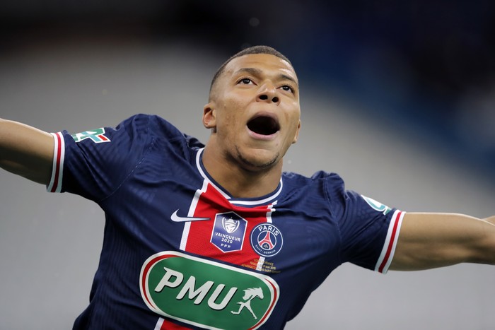 PSGs Kylian Mbappe celebrates after scoring his sides second goal during the French Cup final soccer match between Paris Saint Germain and Monaco at the Stade de France stadium, in Saint Denis, north of Paris, Wednesday, May 19, 2021. (AP Photo/Christophe Ena)