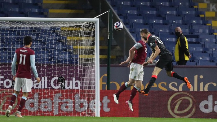 BURNLEY, ENGLAND - MAY 19: Nathaniel Phillips of Liverpool scores their sides second goal during the Premier League match between Burnley and Liverpool at Turf Moor on May 19, 2021 in Burnley, England. A limited number of fans will be allowed into Premier League stadiums as Coronavirus restrictions begin to ease in the UK. (Photo by Martin Rickett - Pool/Getty Images)
