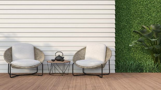 Empty wall exterior 3d render,There are white wood plank wall and wooden floor,decorate with rattan lounge chair, decorate wall with green plant.