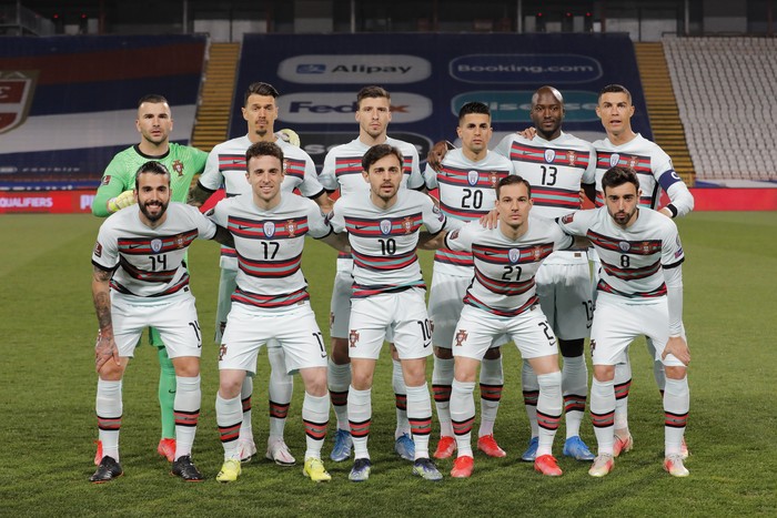BELGRADE, SERBIA - MARCH 27: Portugal players line up for a team group during the FIFA World Cup 2022 Qatar qualifying match between Serbia and Portugal at FK Crvena Zvezda stadium on March 27, 2021 in Belgrade, Serbia. Sporting stadiums around Serbia remain under strict restrictions due to the Coronavirus Pandemic as Government social distancing laws prohibit fans inside venues resulting in games being played behind closed doors.  (Photo by Srdjan Stevanovic/Getty Images)