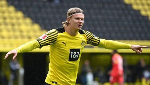Dortmund's Norwegian forward Erling Braut Haaland celebrates the 1-0 during the German first division Bundesliga football match Borussia Dortmund vs Bayer Leverkusen, in Dortmund on May 22, 2021. (Photo by Ina FASSBENDER / POOL / AFP) / DFL REGULATIONS PROHIBIT ANY USE OF PHOTOGRAPHS AS IMAGE SEQUENCES AND/OR QUASI-VIDEO