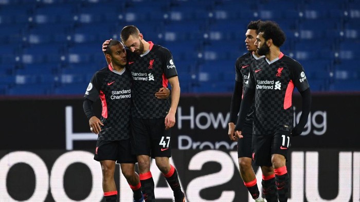 BURNLEY, ENGLAND - MAY 19: Nathaniel Phillips of Liverpool celebrates with team mate Thiago (L) after scoring their sides second goal during the Premier League match between Burnley and Liverpool at Turf Moor on May 19, 2021 in Burnley, England. A limited number of fans will be allowed into Premier League stadiums as Coronavirus restrictions begin to ease in the UK. (Photo by Clive Mason/Getty Images)