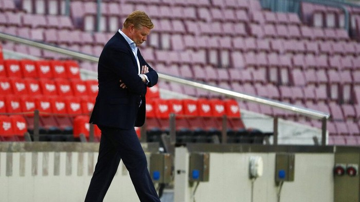 Barcelonas head coach Ronald Koeman walks during the Spanish La Liga soccer match between FC Barcelona and Celta at the Camp Nou stadium in Barcelona, Spain, Sunday, May. 16, 2021. (AP Photo/Joan Monfort)