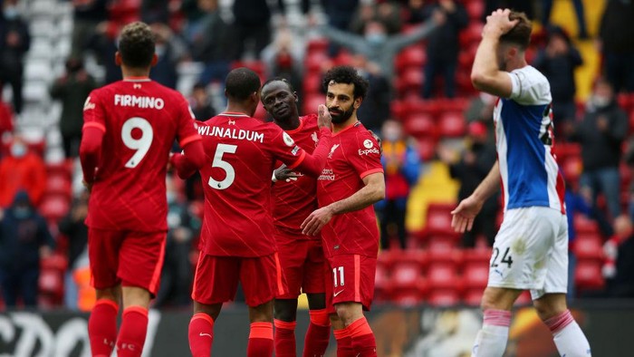 LIVERPOOL, ENGLAND - MAY 23: Sadio Mane of Liverpool celebrates with Mohamed Salah and Georginio Wijnaldum after scoring their sides second goal during the Premier League match between Liverpool and Crystal Palace at Anfield on May 23, 2021 in Liverpool, England. A limited number of fans will be allowed into Premier League stadiums as Coronavirus restrictions begin to ease in the UK. (Photo by Alex Livesey/Getty Images)