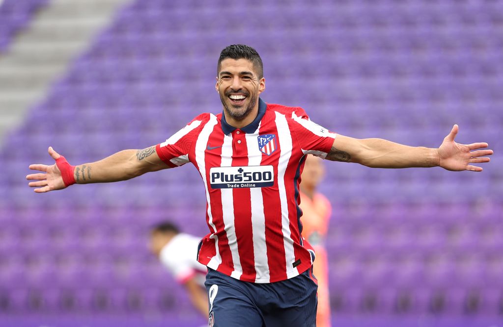 VALLADOLID, SPAIN - MAY 22: Luis Suarez of Atletico de Madrid celebrates after scoring their side's second goal during the La Liga Santander match between Real Valladolid CF and Atletico de Madrid at Estadio Municipal Jose Zorrilla on May 22, 2021 in Valladolid, Spain. Sporting stadiums around Spain remain under strict restrictions due to the Coronavirus Pandemic as Government social distancing laws prohibit fans inside venues resulting in games being played behind closed doors (Photo by Angel Martinez/Getty Images)