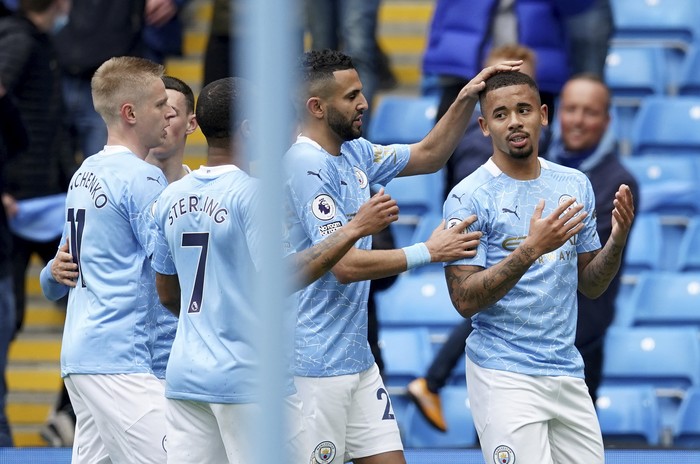 Manchester Citys Gabriel Jesus , right, celebrates with teammates after scoring his sides second goal during the English Premier League soccer match between Manchester City and Everton at the Etihad stadium in Manchester, Sunday, May 23, 2021.(AP Photo/Dave Thompson, Pool)