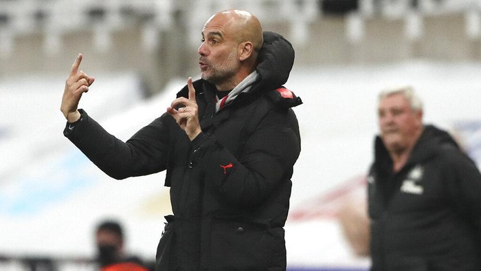 Manchester Citys head coach Pep Guardiola gives instructions from the side line during the English Premier League soccer match between Newcastle United and Manchester City at St James Park stadium, in Newcastle, England, Friday, May 14, 2021. (AP Photo/Scott Heppell, Pool)