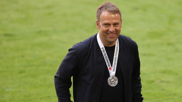 MUNICH, GERMANY - MAY 22: Hans-Dieter Flick, Head coach of FC Bayern Muenchen smiles after the Bundesliga match between FC Bayern Muenchen and FC Augsburg at Allianz Arena on May 22, 2021 in Munich, Germany. After the Bavarian cabinet decided on first relaxations for outdoor events, the current Corona situation allows FC Bayern to have its last match of the season in front of 250 spectators in the Allianz Arena. Of these, 100 tickets are given to people from the health sector selected by the Ministry of Health. (Photo by Alexander Hassenstein/Getty Images)