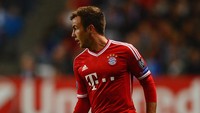 Mario Goetze juga bisa langsung membawa gelar juara Bundesliga untuk Bayern Munich, usai pindah dari Borussia Dortmund pada 2013/2014. Di musim pertamanya, Goetze juga mencetak 15 gol dari 45 penampilan. (Foto: Laurence Griffiths/Getty Images)