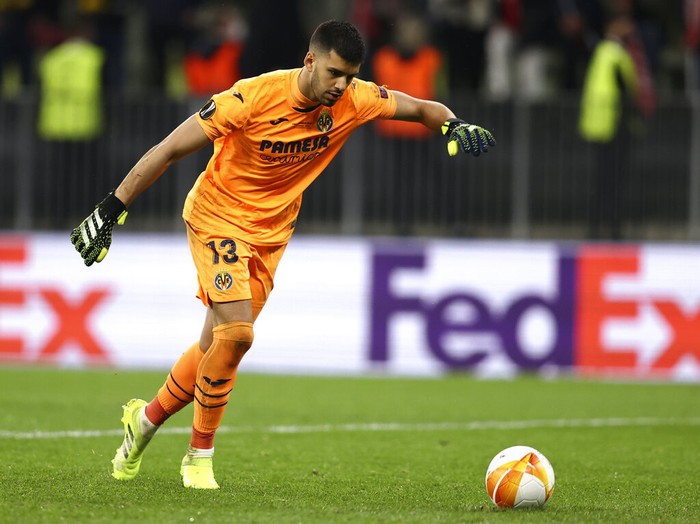 Villareal's goalkeeper Geronimo Rulli shoots to score during the penalty shoot out of the Europa League final soccer match between Manchester United and Villarreal in Gdansk, Poland, Wednesday May 26, 2021. (Maja Hitij, Pool via AP)