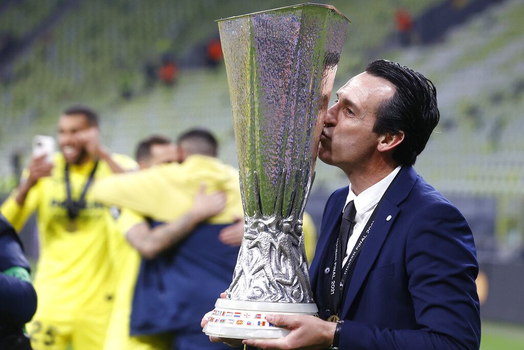 Villarreal's manager Unai Emery poses with the trophy after the Europa League final soccer match between Manchester United and Villarreal in Gdansk, Poland, Wednesday May 26, 2021. (Kacper Pempel, Pool via AP)