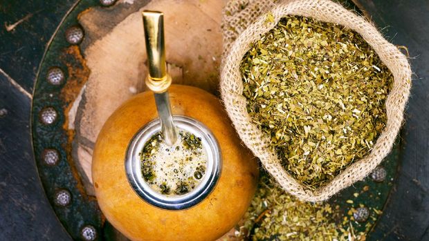 Yerba mate in a traditional calabash gourd and bag of dry herb. (iStockphoto/anyaivanova)