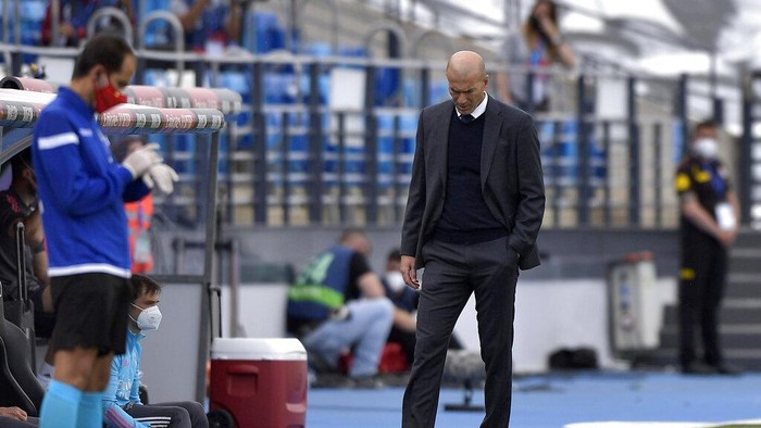 Real Madrids head coach Zinedine Zidane walks by the touchline during the Spanish La Liga last round soccer match between Real Madrid and Villarreal at the Alfredo Di Stefano stadium in Madrid, Saturday, May 22, 2021. (AP Photo/Pablo Morano)