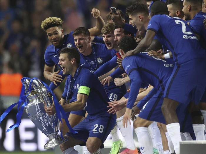 Chelsea supporters celebrate in west London, England after their team won the Champions League final soccer match between Manchester City and Chelsea which is being played at the Dragao stadium in Porto, Portugal, Saturday, May 29, 2021. Chelsea won the match 1-0. (AP Photo/Matt Dunham)
