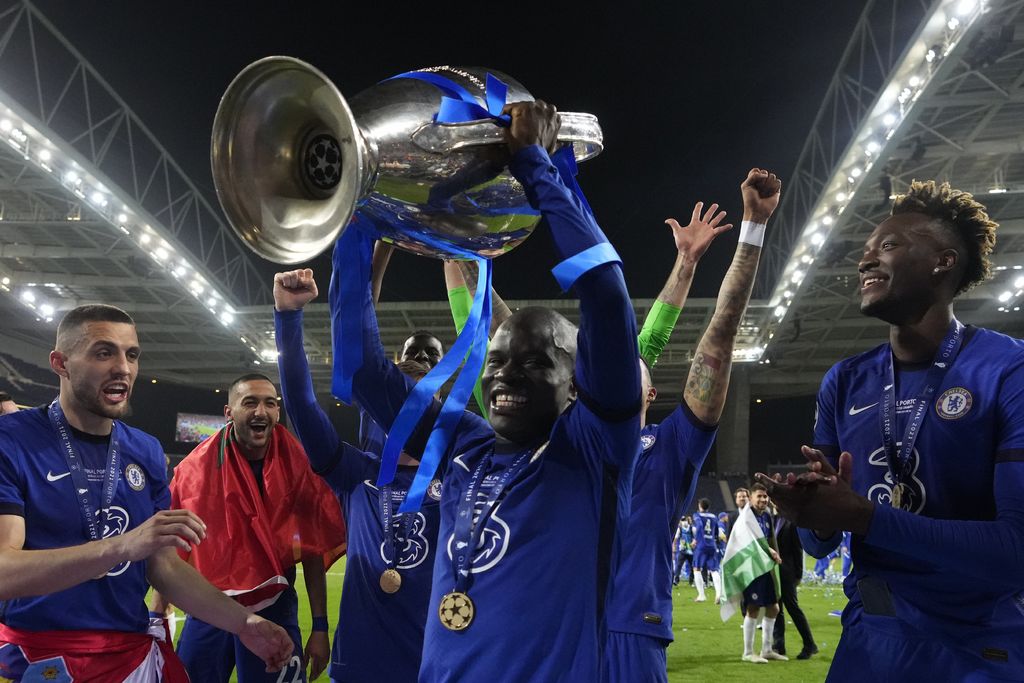 Chelsea's N'Golo Kante celebrates with the trophy after winning the Champions League final soccer match between Manchester City and Chelsea at the Dragao Stadium in Porto, Portugal, Saturday, May 29, 2021. (AP Photo/Manu Fernandez, Pool)