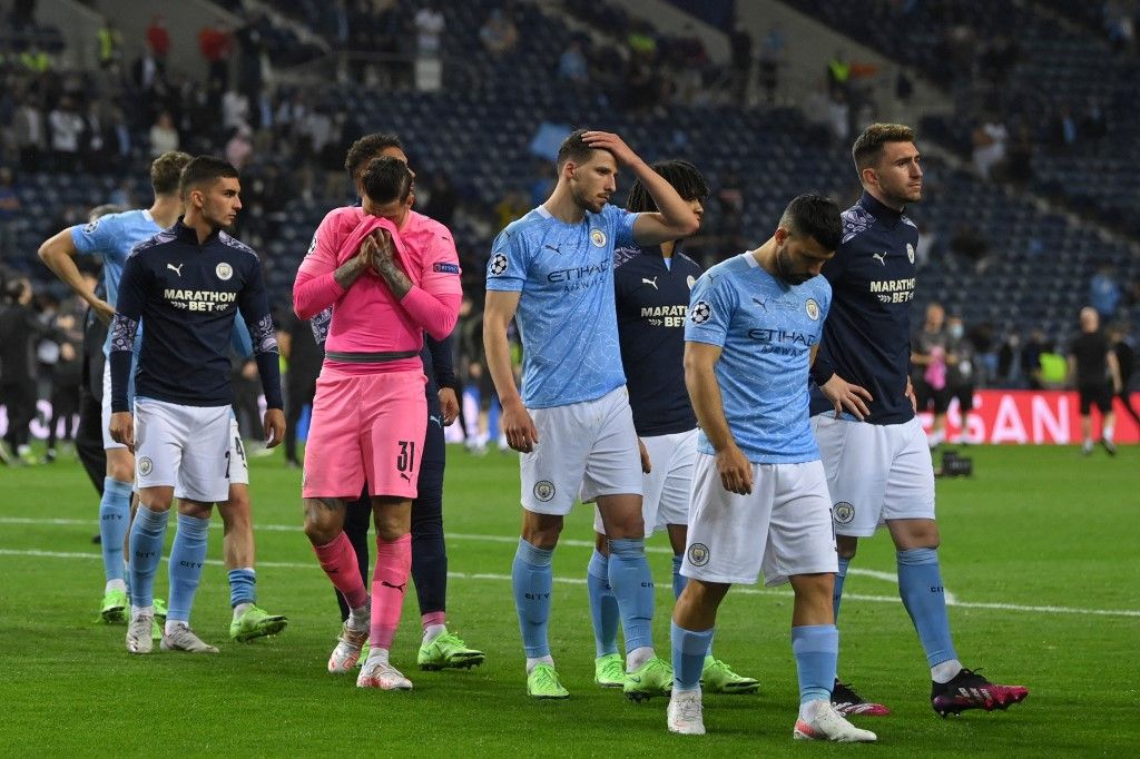 Manchester City's players react at the end of the UEFA Champions League final football match between Manchester City and Chelsea FC at the Dragao stadium in Porto on May 29, 2021. (Photo by David Ramos / various sources / AFP)