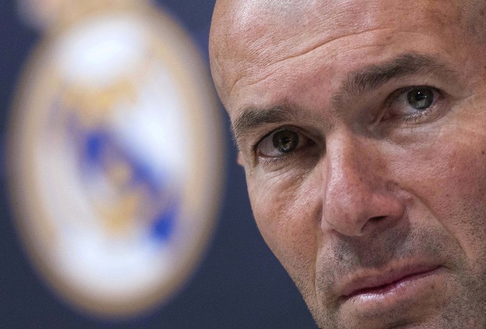 FILE - in this Thursday, May 31, 2018 file photo Zinedine Zidane listens to the questions of journalists during a press conference in Madrid, Spain. Zinedine Zidane is again stepping down as Real Madrid coach. The club says the Frenchman is leaving his job. It comes four days after a season in which Madrid failed to win a title for the first time in more than a decade. (AP Photo/Borja B. Hojas, File)
