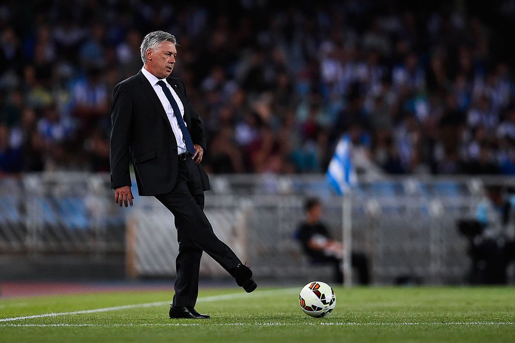 SAN SEBASTIAN, SPAIN - AUGUST 31:  Head Coach Carlo Ancelotti of Real Madrid CF kicks the ball during the La Liga match between Real Sociedad de Futbol and Real Madrid CF at Estadio Anoeta on August 31, 2014 in San Sebastian, Spain.  (Photo by David Ramos/Getty Images)