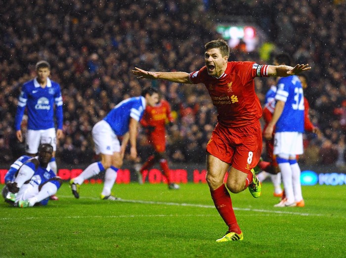 LIVERPOOL, ENGLAND - JANUARY 28:  Steven Gerrard of Liverpool celebrates after scoring the opening goal during the Barclays Premier League match between Liverpool and Everton at Anfield on January 28, 2014 in Liverpool, England.  (Photo by Laurence Griffiths/Getty Images)