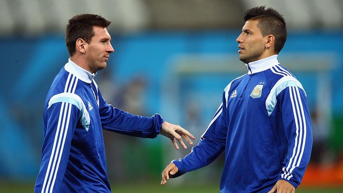 SAO PAULO, BRAZIL - JULY 08:  (L-R) Lionel Messi and Sergio Aguero stretch during a training session at Arena de Sao Paulo on July 8, 2014 in Sao Paulo, Brazil.  (Photo by Ronald Martinez/Getty Images)