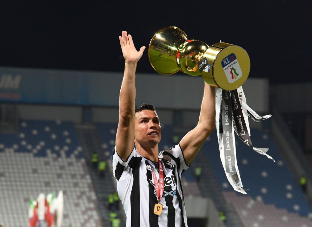 REGGIO NELL'EMILIA, ITALY - MAY 18: Cristiano Ronaldo of Juventus celebrates with the TIMVISION cup following the TIMVISION Cup Final between Atalanta BC and Juventus on May 18, 2021 in Reggio nell'Emilia, Italy. (Photo by Claudio Villa/Getty Images for Lega Serie A)