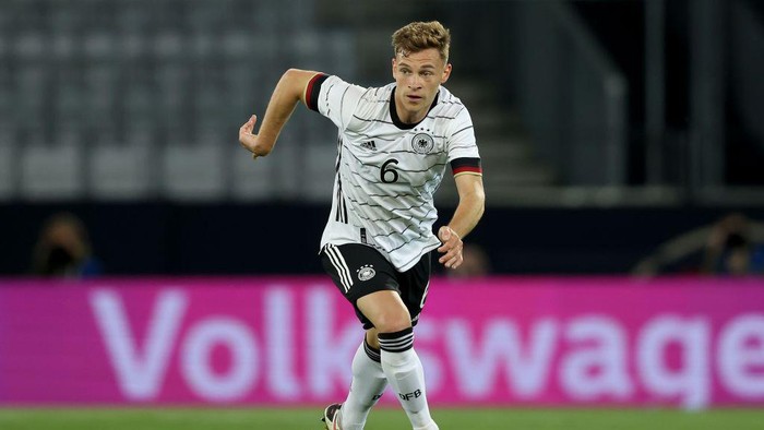 Joshua Kimmich INNSBRUCK, AUSTRIA - JUNE 02: Joshua Kimmich of Germany runs with the ball during the international friendly match between Germany and Denmark at Tivoli Stadion on June 02, 2021 in Innsbruck, Austria. (Photo by Alexander Hassenstein/Getty Images)