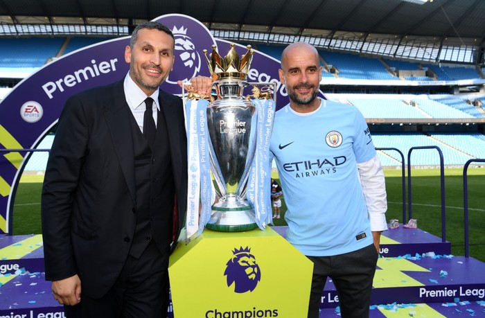 MANCHESTER, ENGLAND - MAY 06:  Khaldoon al-Mubarak, Manchester City chairman and Josep Guardiola, Manager of Manchester City pose with the Premier League trophy as Manchester City win the Premier League after the Premier League match between Manchester City and Huddersfield Town at Etihad Stadium on May 6, 2018 in Manchester, England.  (Photo by Michael Regan/Getty Images)