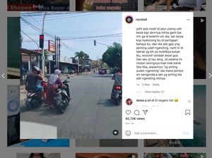 Duh! Emak-emak Santai Parkir Motor di Tengah Jalan saat Lampu Merah