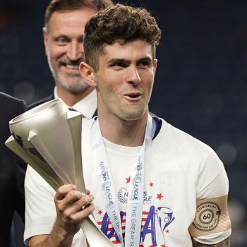 United States' Christian Pulisic (10) holds the championship trophy while celebrating their win against Mexico following the CONCACAF Nations League championship soccer match, Sunday, June 6, 2021, in Denver. (AP Photo/Jack Dempsey)