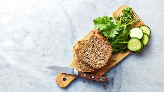 Ingredients for healthy home made sandwiches. Rye bread, spinach, young kale, cucumber, radish sprouts. Healthy eating concept. Flat lay