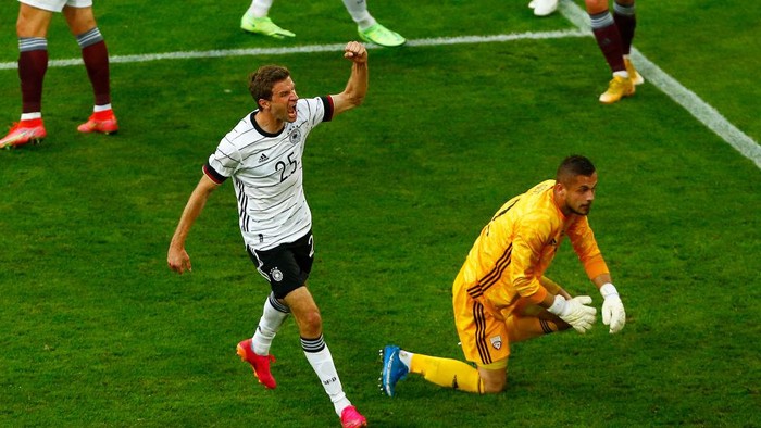 DUESSELDORF, GERMANY - JUNE 07: Thomas Muller of Germany celebrates after scoring their sides third goal during the international friendly match between Germany and Latvia at Merkur Spiel-Arena on June 07, 2021 in Duesseldorf, Germany. (Photo by Thilo Schmuelgen - Pool/Getty Images)