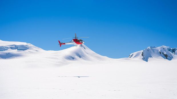 Aerial View from Helicopter on snow mountain in Fox Glacier town Southern Alps Mountain Valleys  , New Zealand. The helicopter service in Mt Cook offers scenic flights