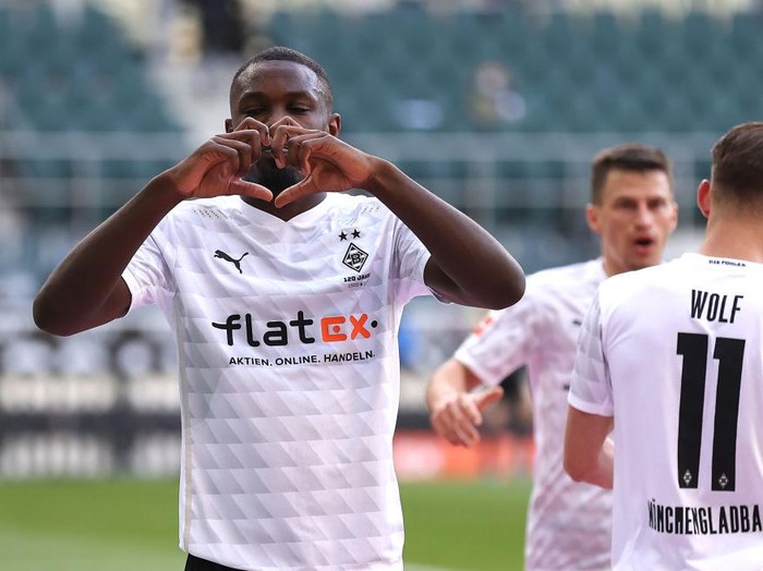 MOENCHENGLADBACH, GERMANY - APRIL 25: Marcus Thuram of Borussia Moenchengladbach celebrates after scoring their side's second goal during the Bundesliga match between Borussia Moenchengladbach and DSC Arminia Bielefeld at Borussia-Park on April 25, 2021 in Moenchengladbach, Germany. Sporting stadiums around Germany remain under strict restrictions due to the Coronavirus Pandemic as Government social distancing laws prohibit fans inside venues resulting in games being played behind closed doors. (Photo by Lars Baron/Getty Images)