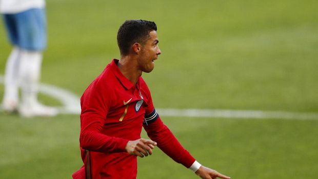Portugal's Cristiano Ronaldo celebrates after scoring his side's second goal during the international friendly soccer match between Portugal and Israel at the Alvalade stadium in Lisbon, Wednesday, June 9, 2021. (AP Photo/Armando Franca)