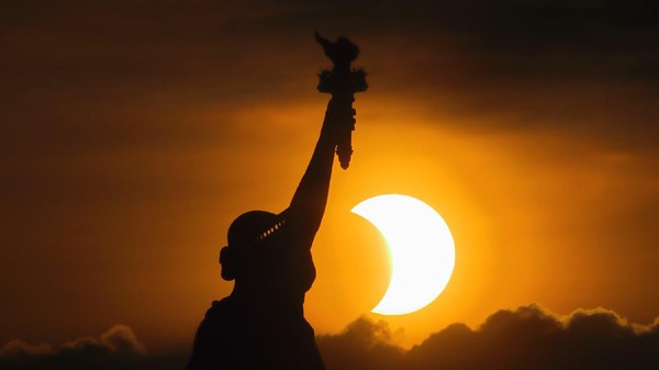 GRAND CANYON NATIONAL PARK, AZ - MAY 20:  A composite of images of the first annular eclipse seen in the U.S. since 1994 shows several stages, left to right, as the eclipse passes through annularity and the sun changes color as it approaches sunset on May 20, 2012 in Grand Canyon National Park, Arizona. Differing from a total solar eclipse, the moon in an annular eclipse appears too small to cover the sun completely, leaving a ring of fire effect around the moon. The eclipse is casting a shallow path crossing the West from west Texas to Oregon then arcing across the northern Pacific Ocean to Tokyo, Japan. (Photo by David McNew/Getty Images)