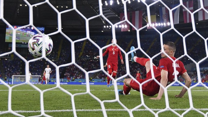 Turkeys Merih Demiral scores an own goal during the Euro 2020, soccer championship group A match between Italy and Turkey, at the Rome Olympic stadium, Friday, June 11, 2021. (Alfredo Falcone/LaPresse via AP)