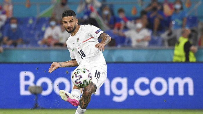 Italys Lorenzo Insigne scores his sides third goal during the Euro 2020 soccer championship group A match between Italy and Turkey at the Olympic stadium in Rome, Friday, June 11, 2021. (Alberto Lingria/Pool Photo via AP)