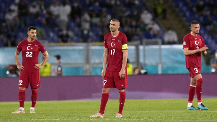 From left, Turkeys Kaan Ayhan, Burak Yilmaz and Merih Demiral react after Italys Lorenzo Insigne scored his sides third goal, during the Euro 2020, soccer championship group A match between Italy and Turkey, at the Rome Olympic stadium, Friday, June 11, 2021. (AP Photo/Alessandra Tarantino, Pool)